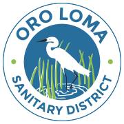 Logo of Oro Loma Sanitary District featuring a white heron standing in water surrounded by green grass.