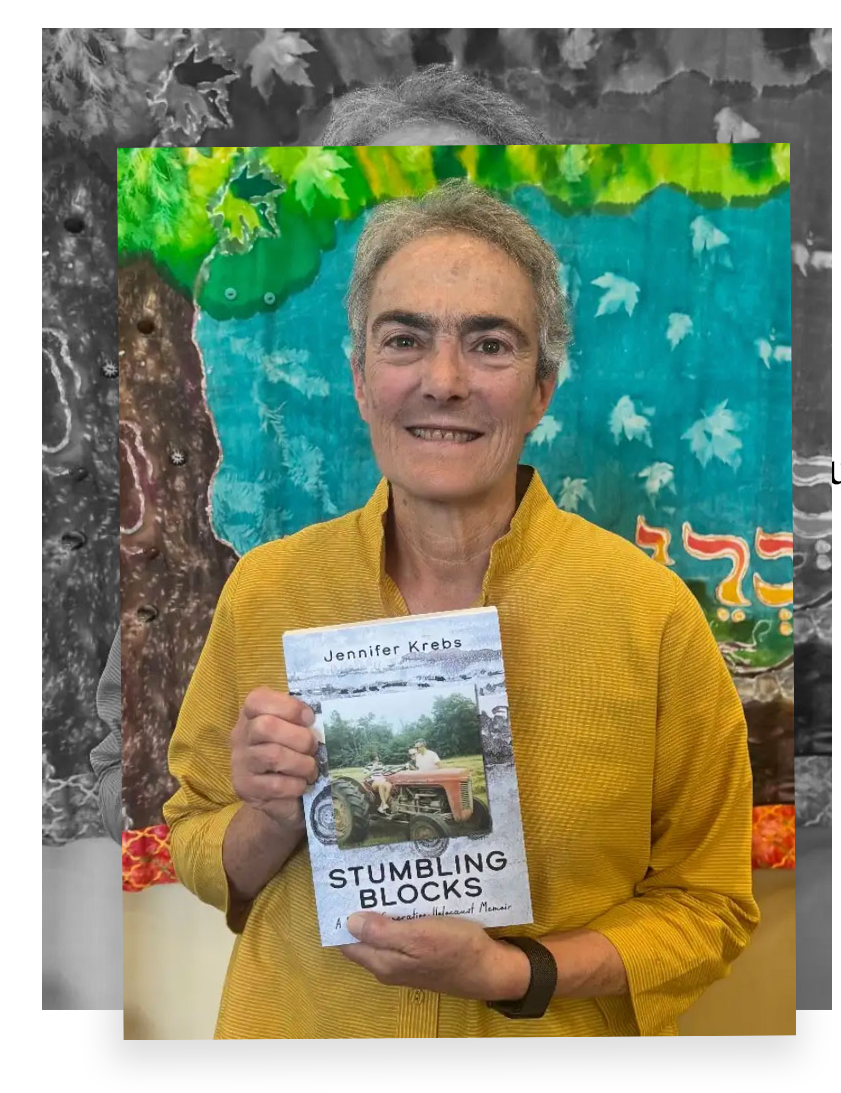 A woman in a yellow shirt holding a book titled "Stumbling Blocks" by Jennifer Krebs in front of a colorful, artistic background with leaves and abstract designs.