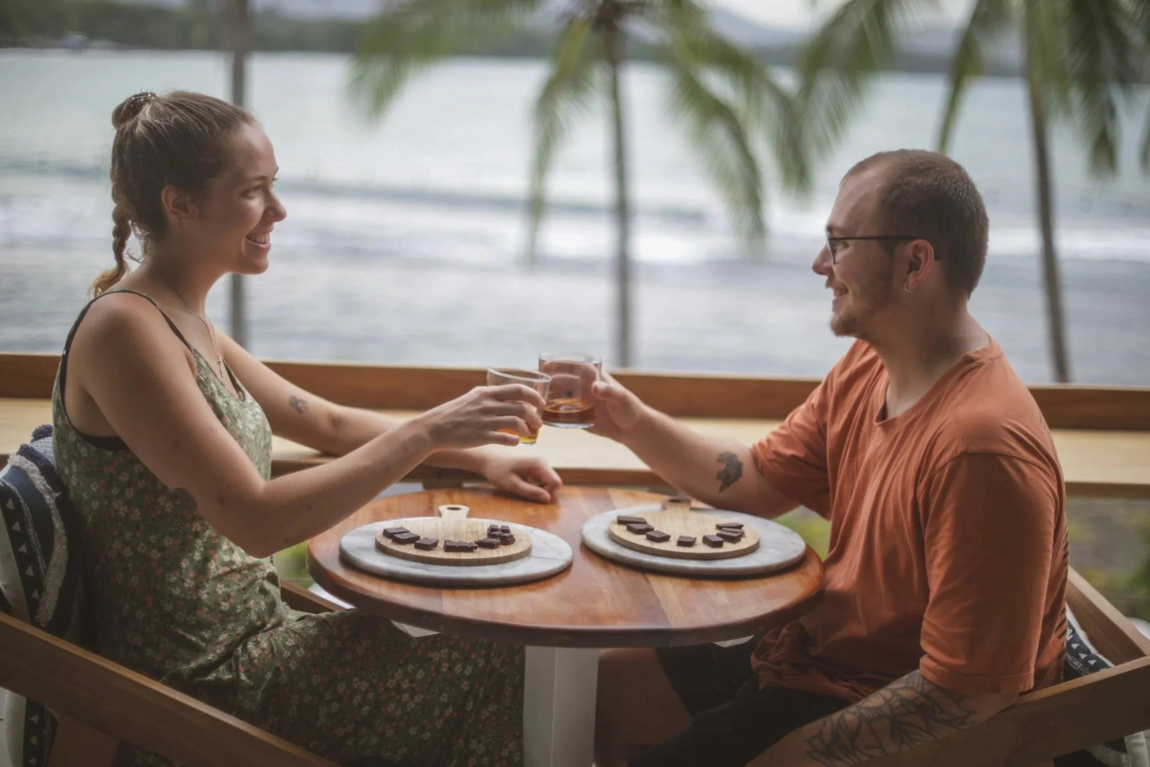 A couple enjoying the sunset views during their Rum and Chocolate Pairing in Puerto Viejo, Costa Rica