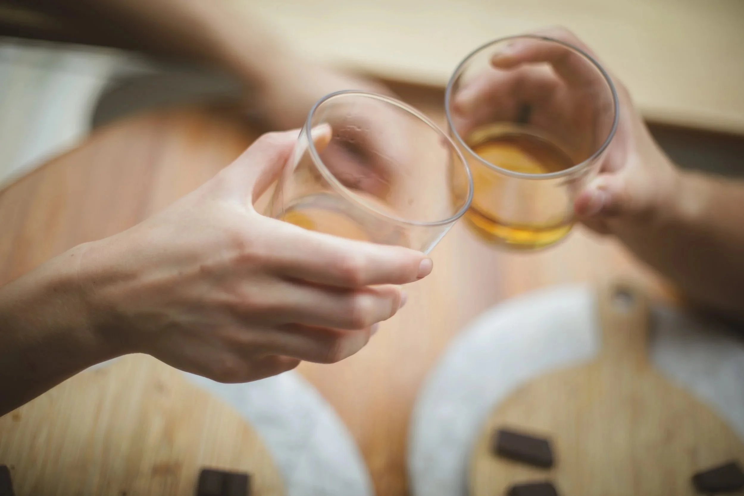 two rum glasses with chocolate below in a rum and chocolate pairing in Puerto Viejo, Costa Rica