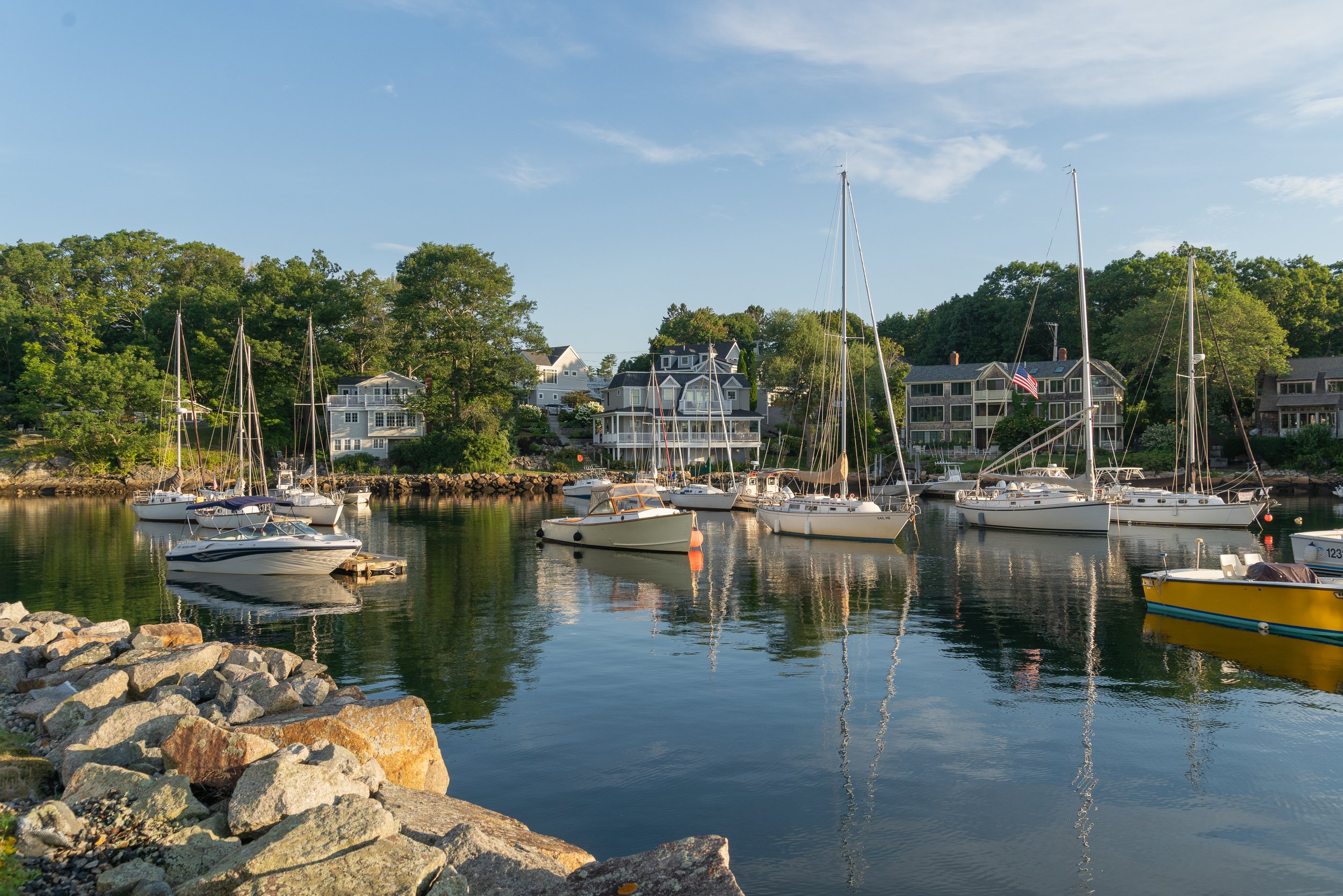 Sailboats and small boats moored in Perkins Cove harbor