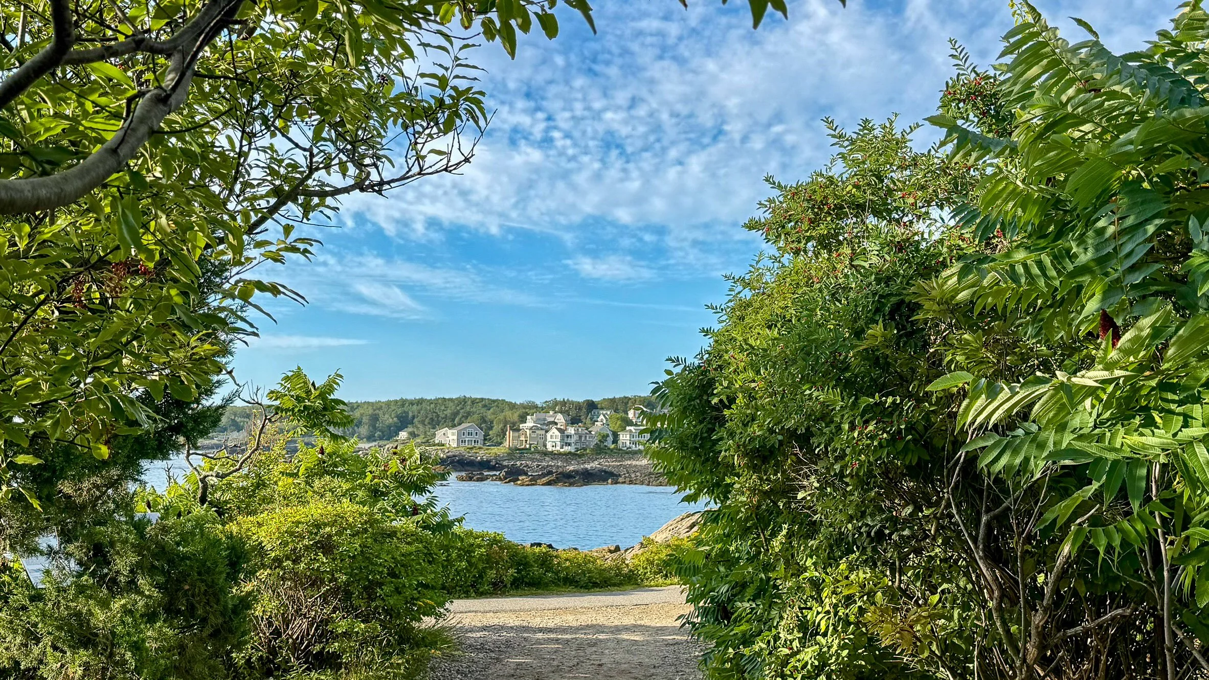 Garden pathway opening toward Perkins Cove and the Ogunquit coastline