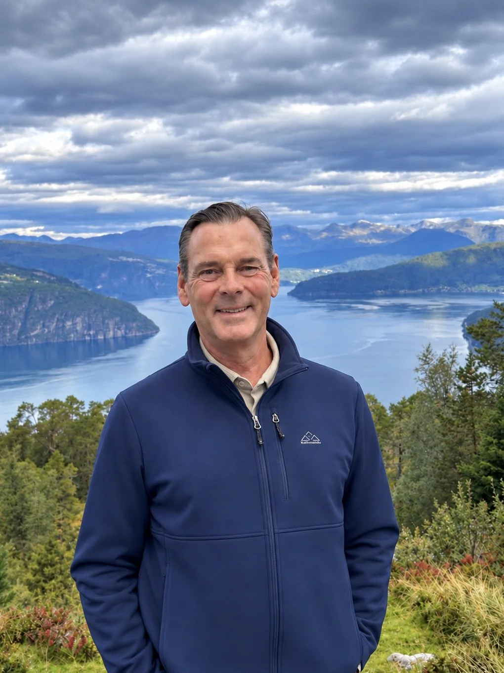 John S Baker, photographer, overlooking a mountain fjord in Norway.