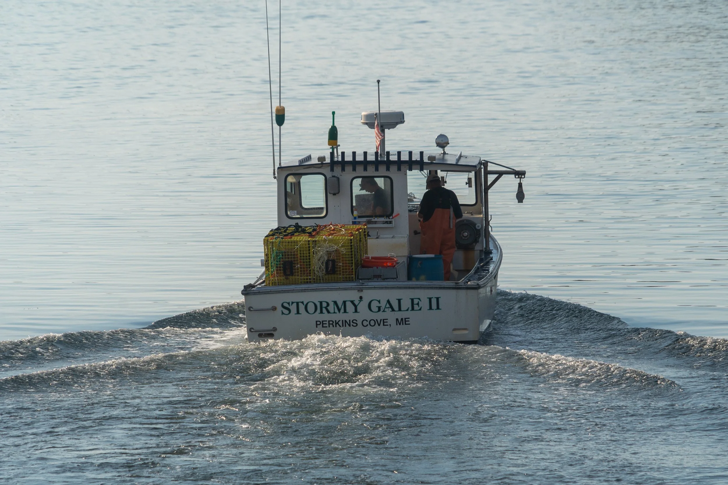 Fishing boat departing Perkins Cove at the beginning of the day