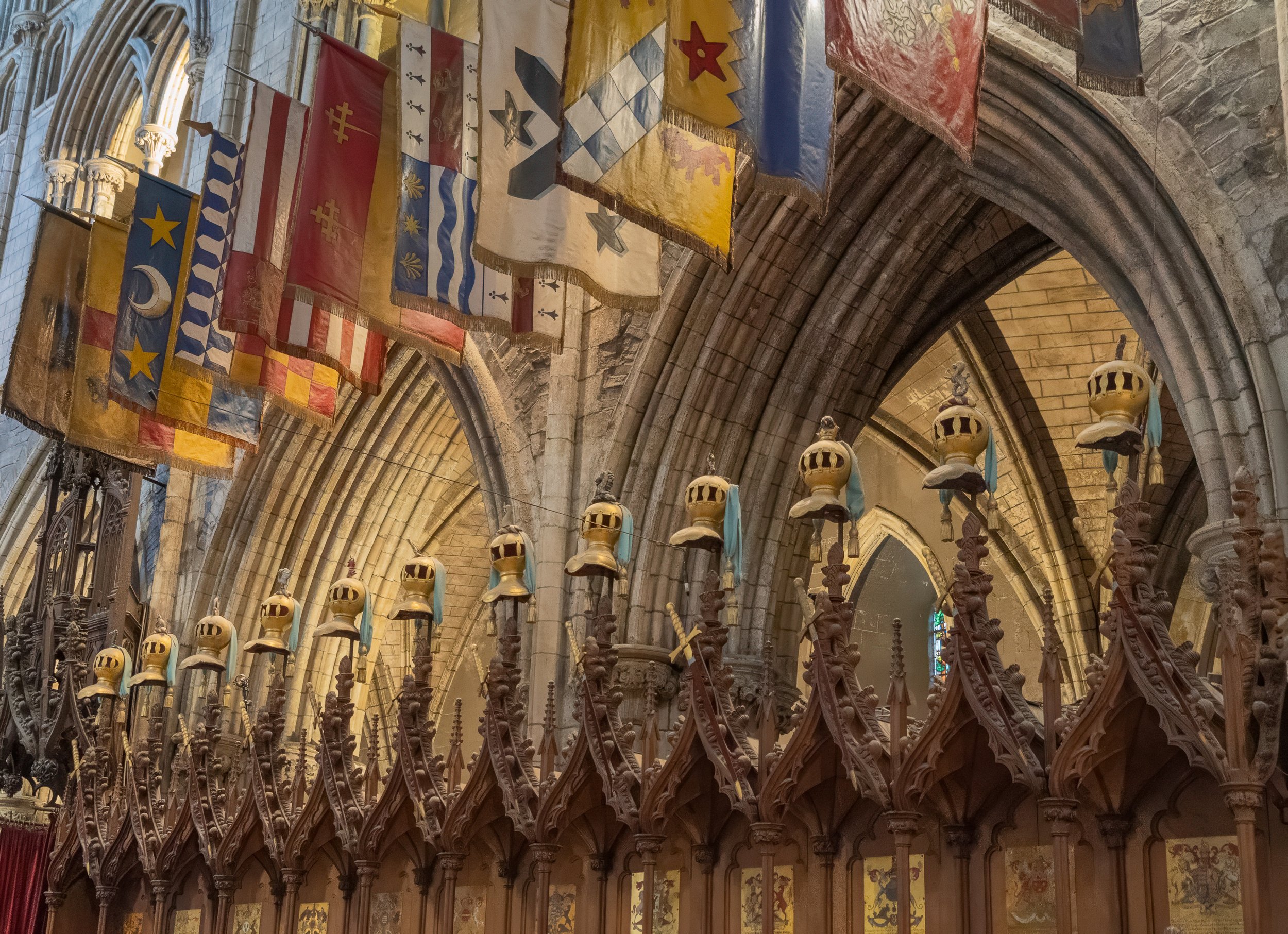 Carved wood, medieval banners, and enduring craftsmanship reflect a living heritage where history, faith, and artistry remain beautifully intertwined.