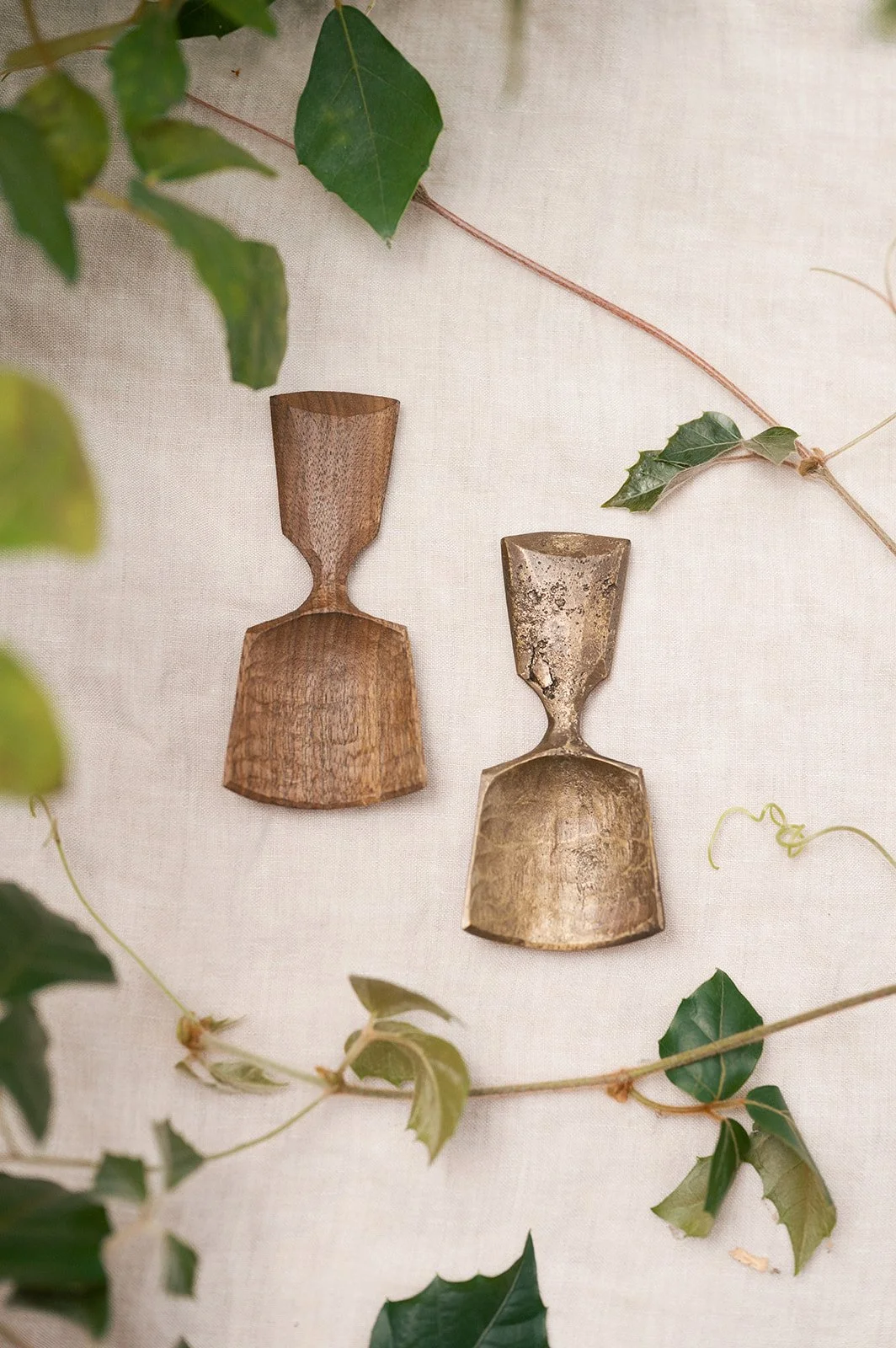 Carved Walnut Scoop and sand cast Bronze Scoop. Carved surface texture for hand carved walnut scoop appears on the bronze casting.