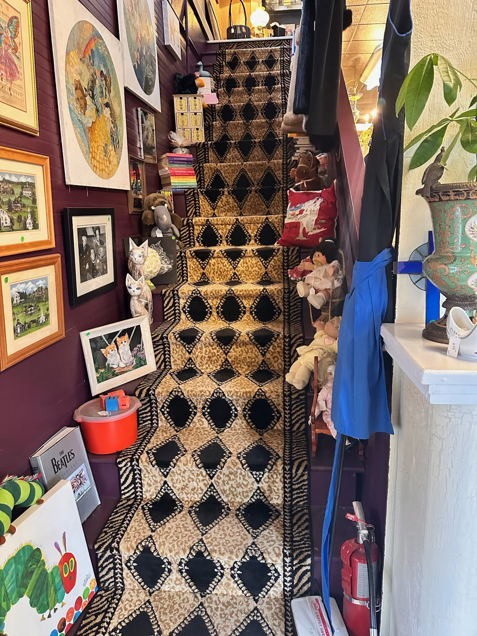 Interior stairway to the upper level in one of the buildings comprising Villa Vintiques in Woodbury, CT.