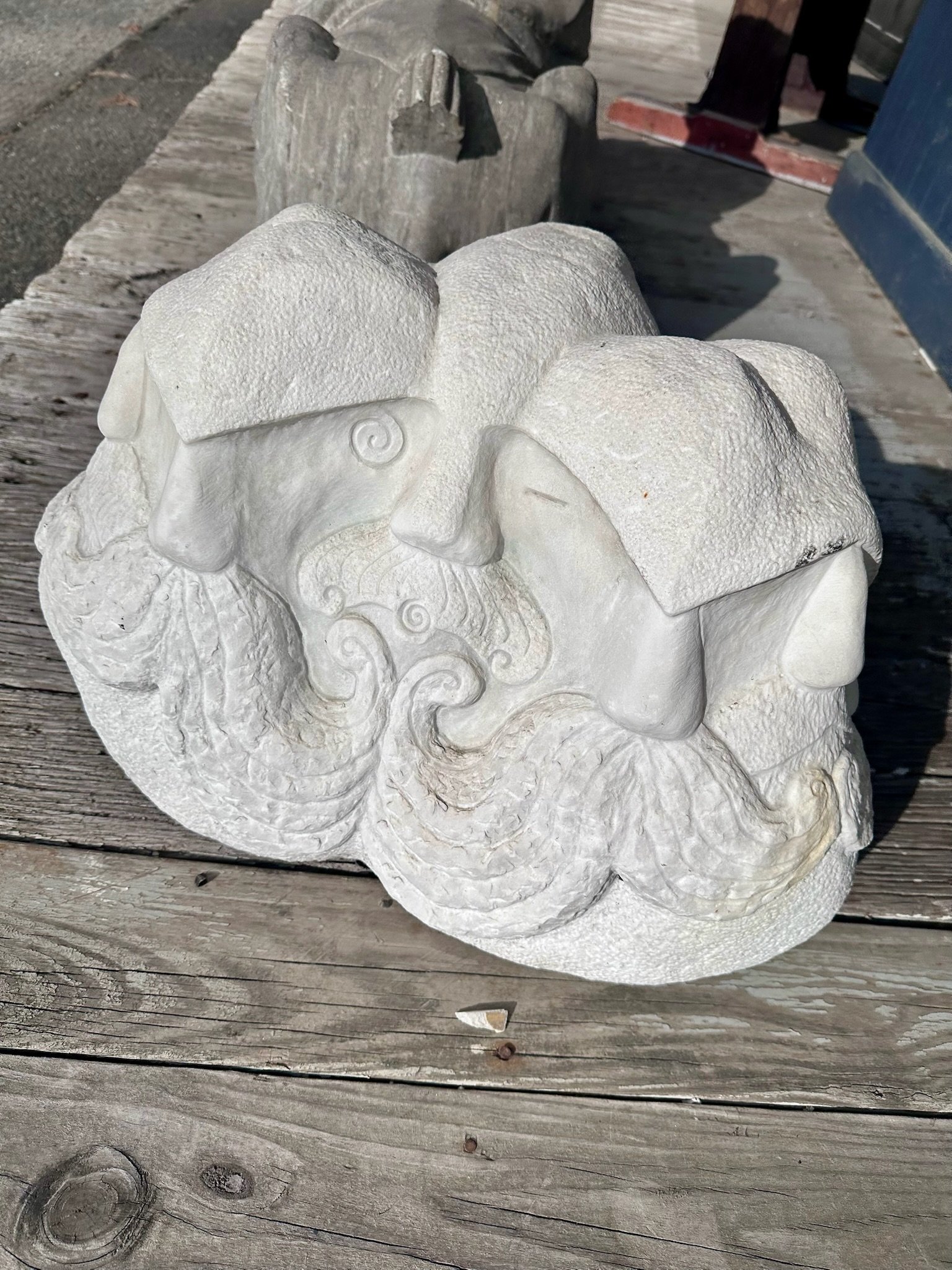 Interesting stone sculpture for sale outside on the platform of VIlla Vintiques.