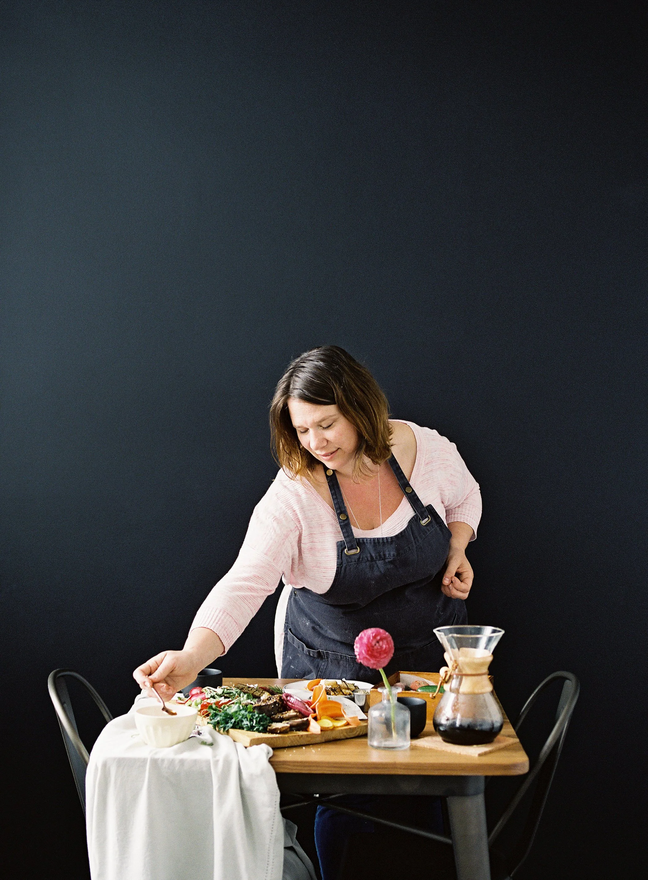 Sarah Chiapparro setting up food