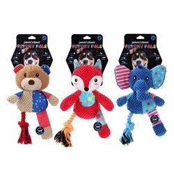 Plush animal toys hanging on packs, including a bear, a fox, and an elephant, dressed in colorful clothing with striped patterns and tassels.