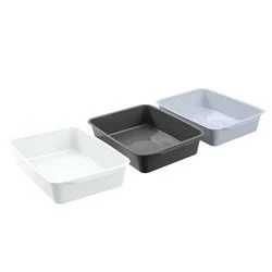 Three rectangular plastic trays in white, black, and gray placed side by side.