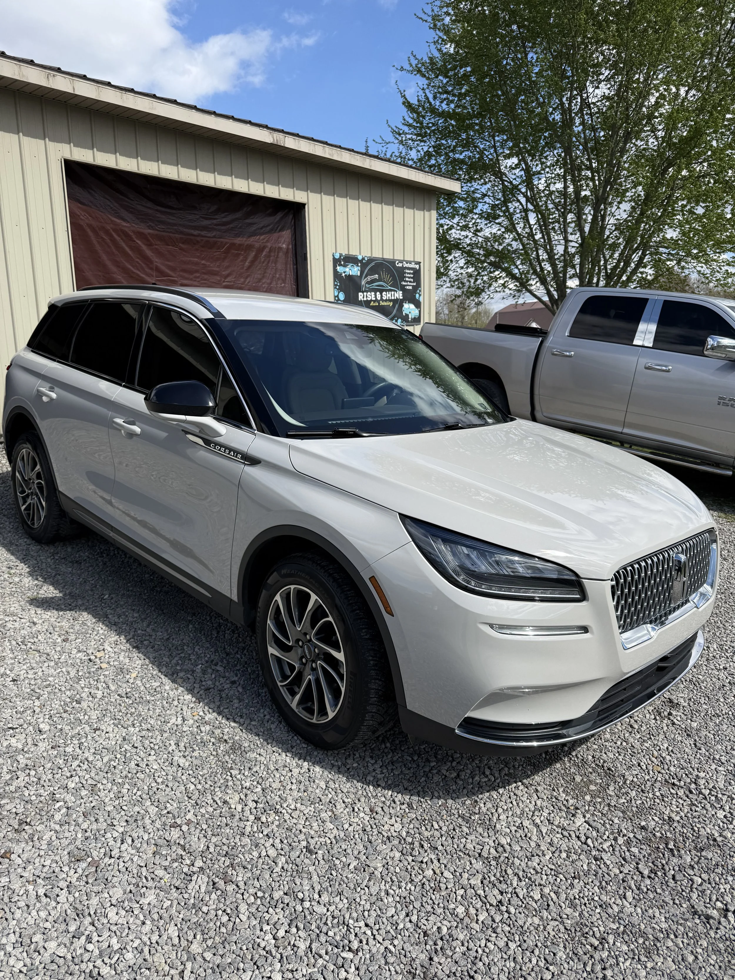 Lincoln vehicle receiving full detail service at shop drop-off location