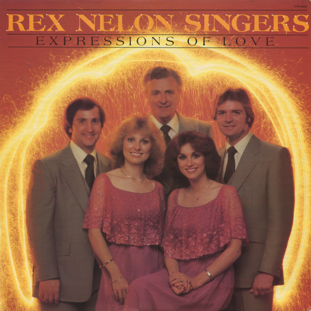 Album cover of Rex Nelson Singers titled 'Expressions of Love' featuring five people in formal attire against a fiery orange background with glowing yellow and orange light streaks.