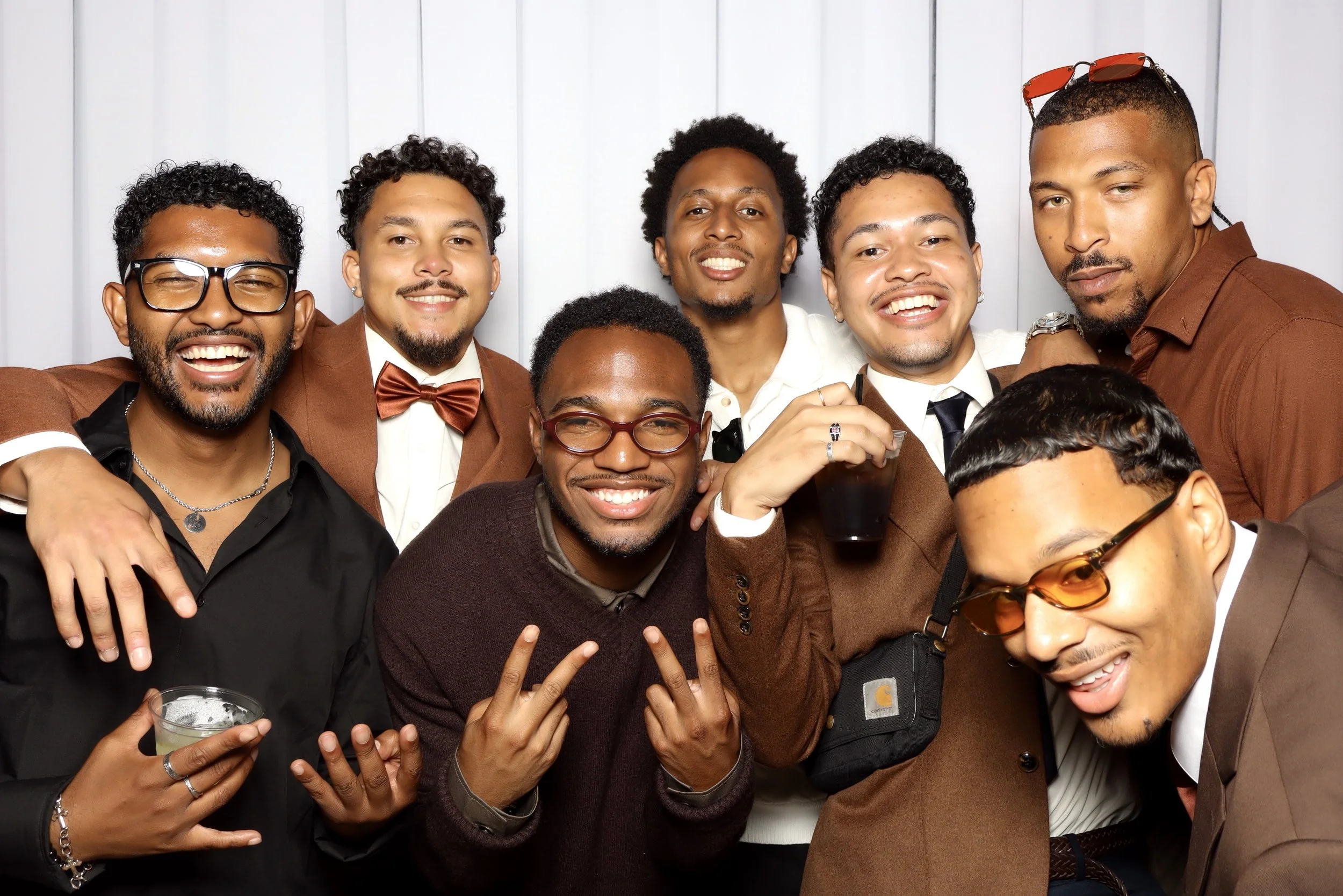 Group of men dressed elegant posing for a picture.