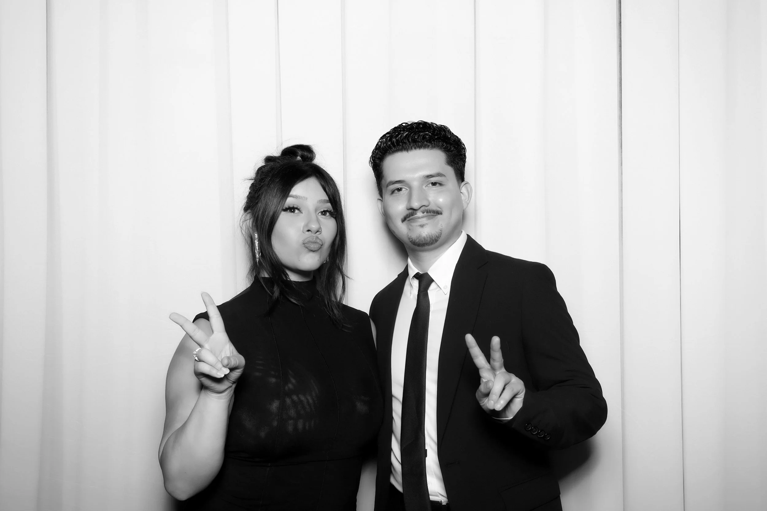 young couple with the peace sign