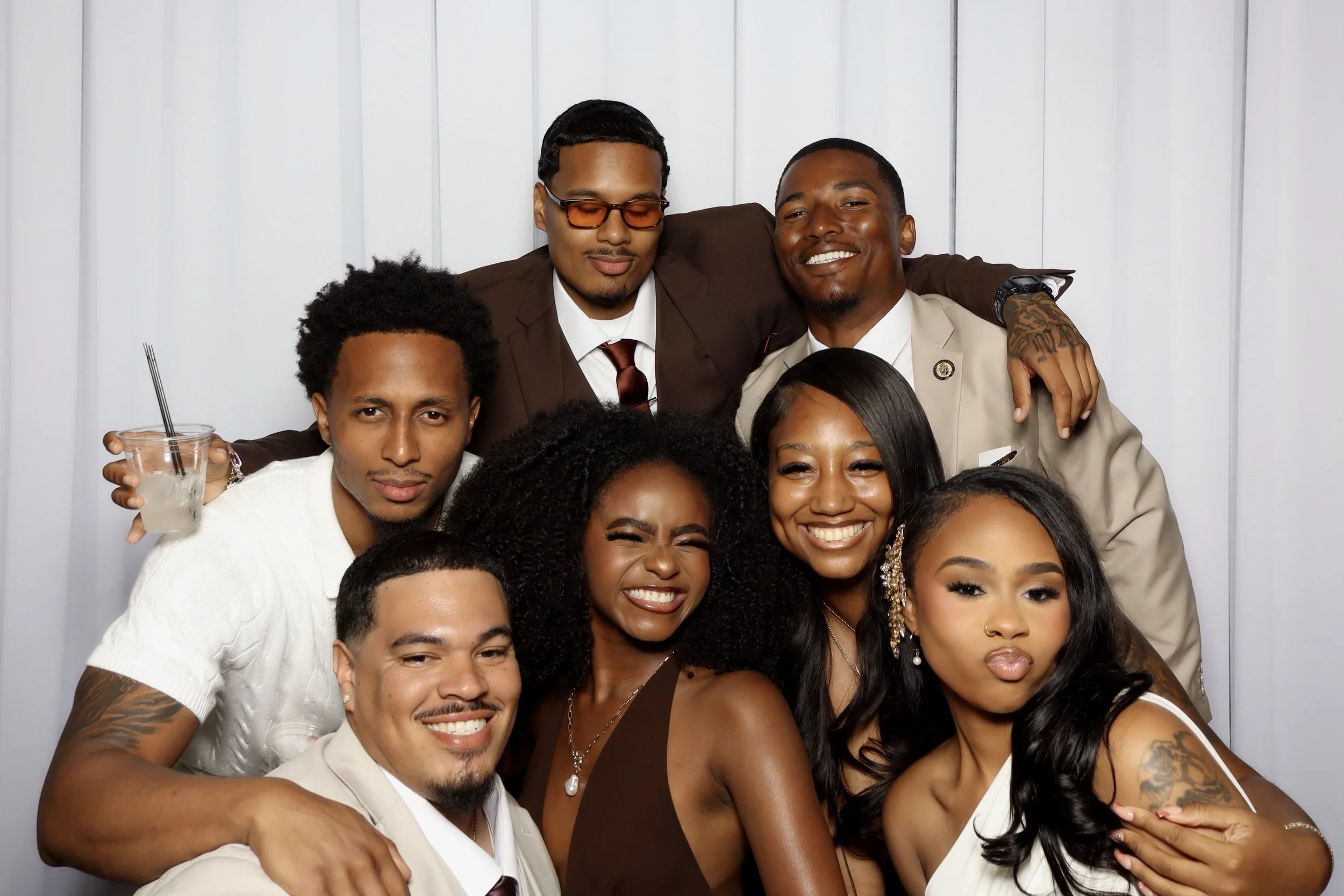 a group of people dressed nice posing for a picture