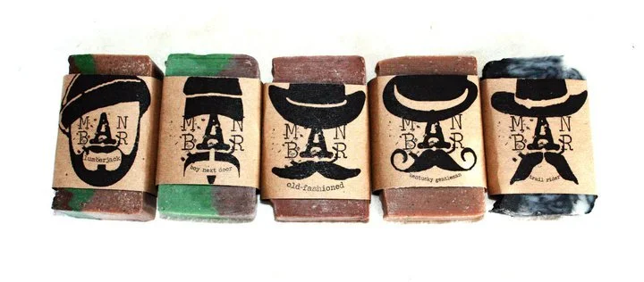 Bars of soap with mustachioed labels