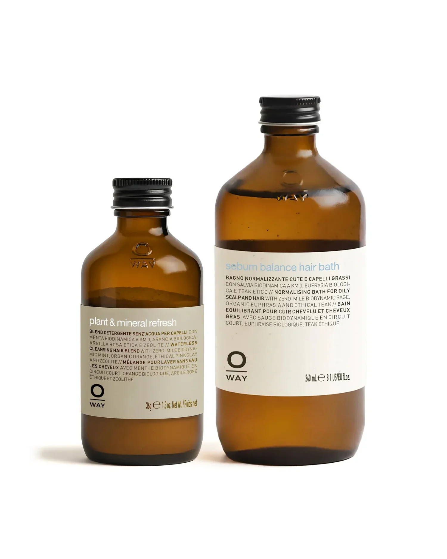 Two brown glass bottles of hair care products, one slightly larger, with white labels and black caps, against a plain white background.