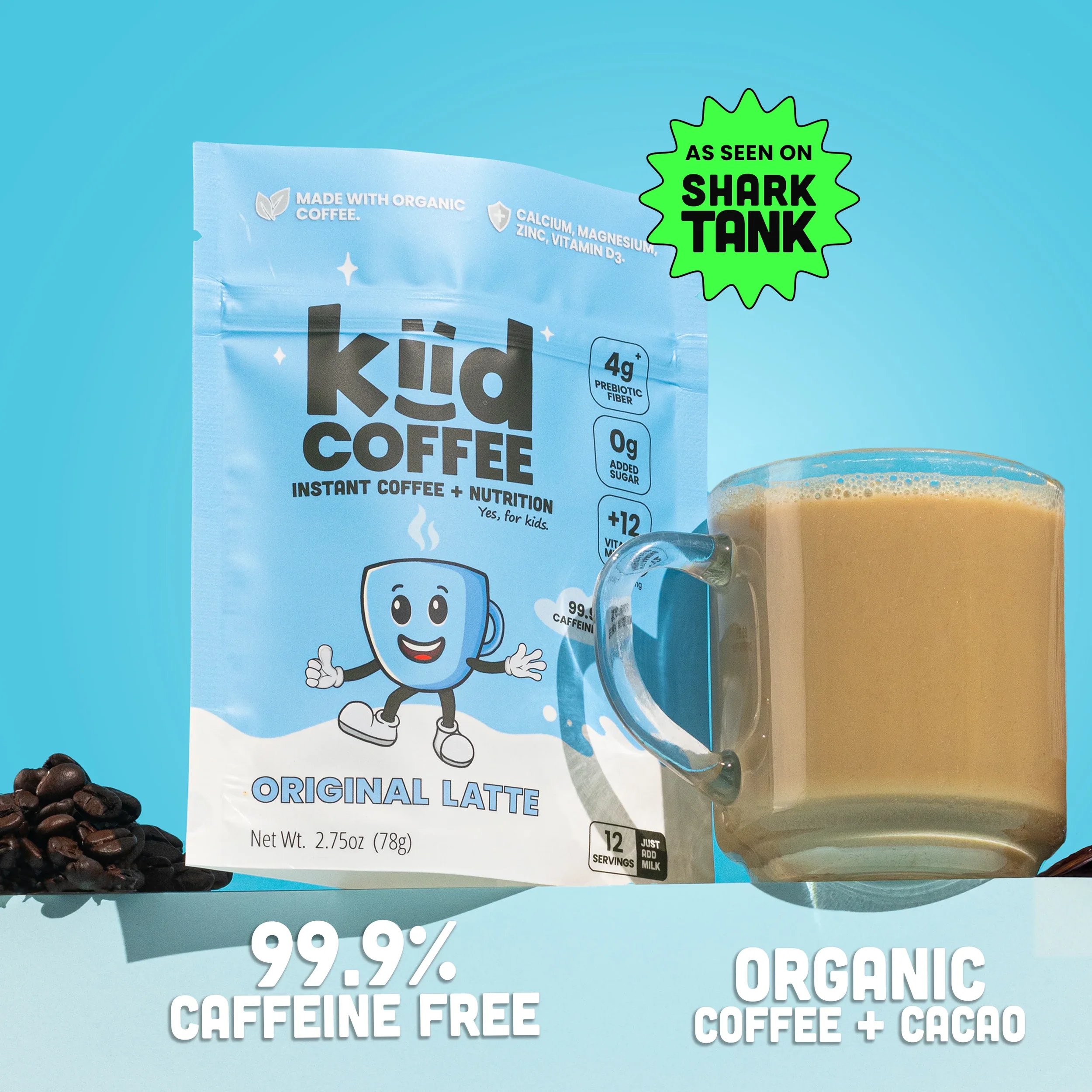 Package of kid's organic coffee with a cartoon smiling coffee cup character and the label indicating organic ingredients, prebiotic fiber, and caffeine-free content. Part of the packaging is visible next to coffee beans and a glass of coffee.
