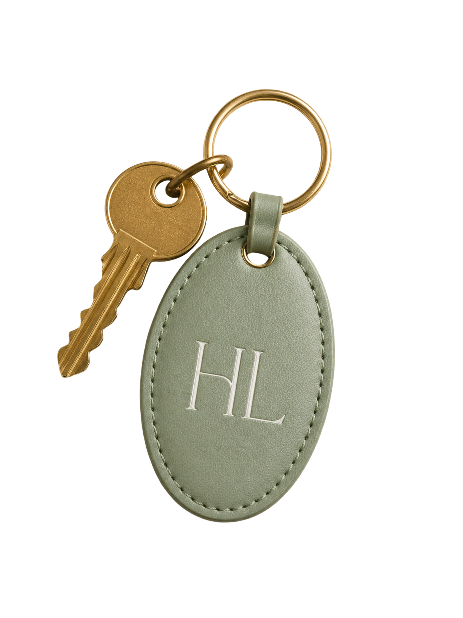 Close-up of a set of keys attached to a light green leather keychain with a monogrammed letter 'H' in white, hung from a gold keyring.