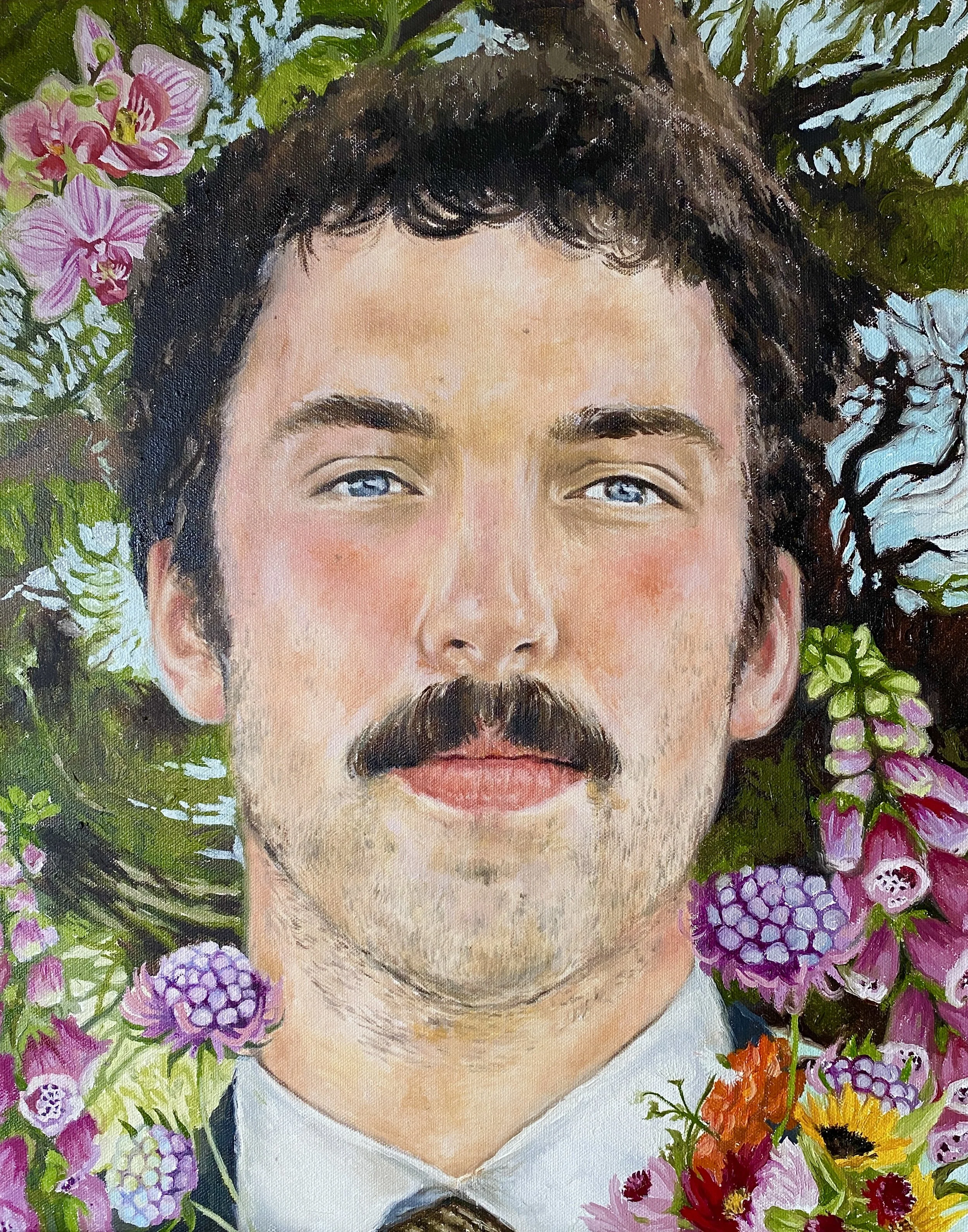 A painting of a man with curly black hair, blue eyes, and a beard, surrounded by colorful flowers including orchids, hydrangeas, sunflowers, and other blossoms.
