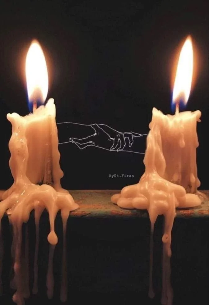 Two melting candles with flames on top, dripping wax, and a black background with a line drawing of a hand holding another hand.