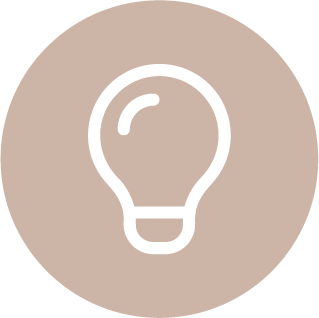 Icon of a light bulb on a beige circular background.
