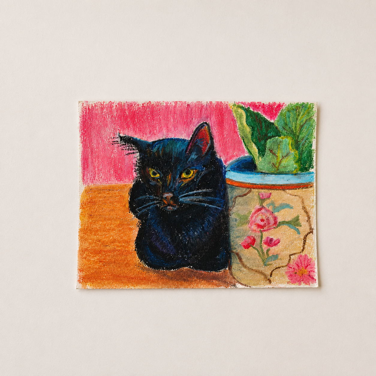 A colorful painting of a black cat sitting next to a potted plant with green leaves, on a wooden surface against a pink background.