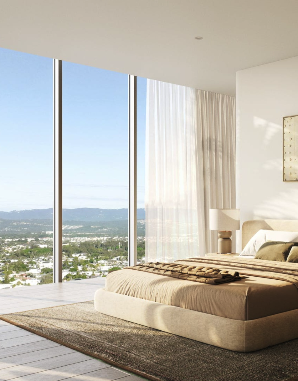 Modern bedroom with large glass windows, view of mountains and cityscape, beige bed with brown blanket, white curtains, lamp, and minimalist decor.