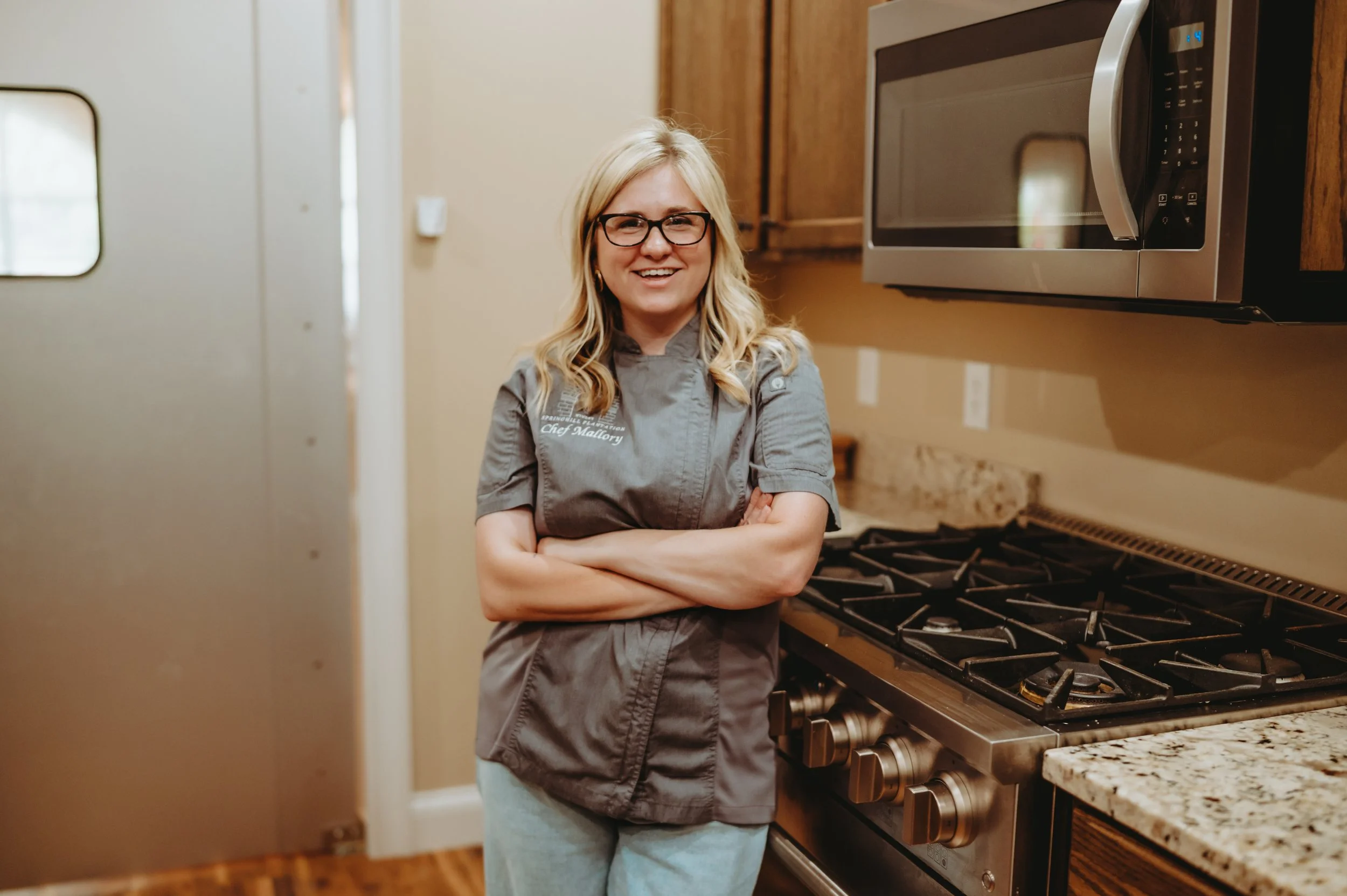 Chef in the Springhill winery kitchen wearing a her chef coat.