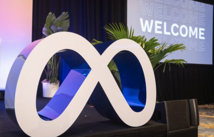 Roaming Meta symbol fabricated as an element that is flexible to be use for content capture, a stage prop, and brand placement throughout the event from UCG content.