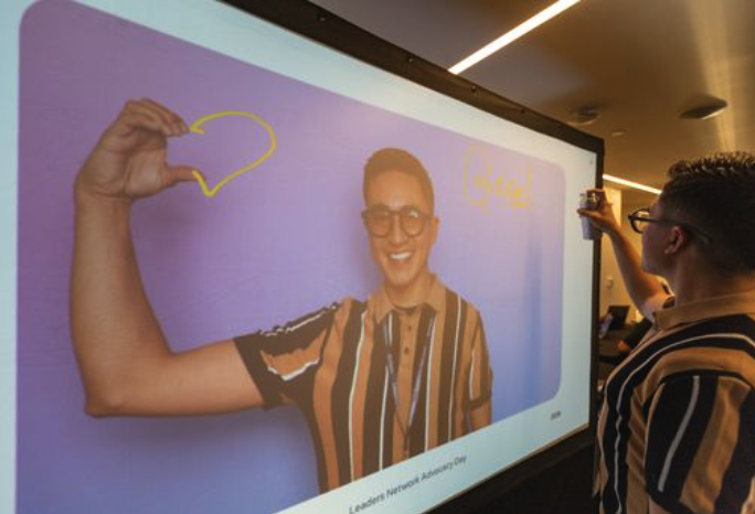Guest interacting with the photo booth and digital graffiti wall