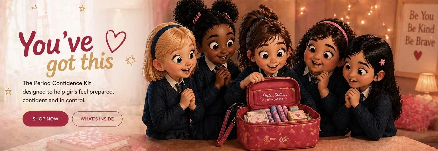 Five animated girls with big eyes and diverse skin tones, wearing navy blue school uniforms, gathered around a pink Period Confidence Kit, smiling and excited.