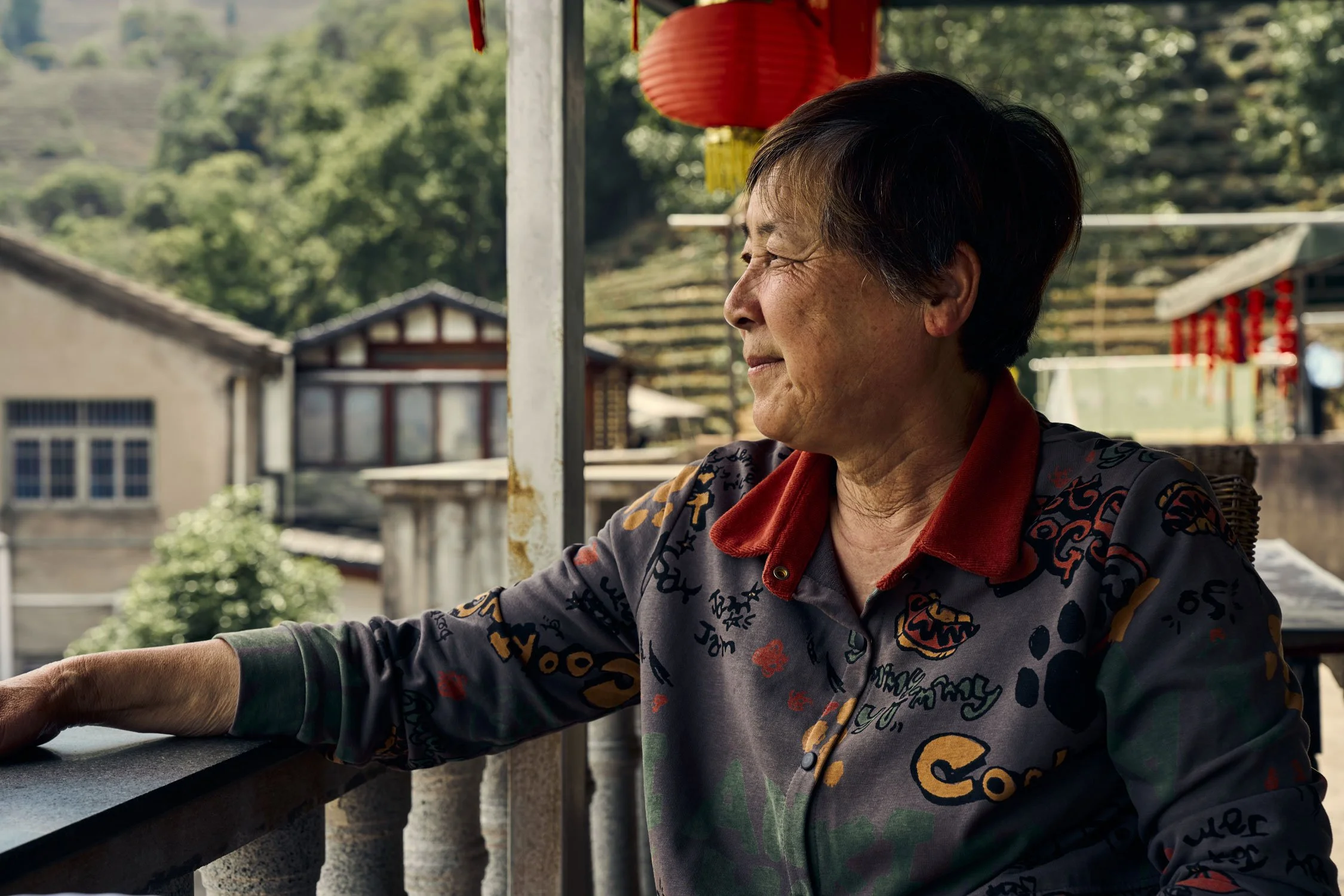  Ying Xiao Qin looks out over Longjing Village from her balcony 
