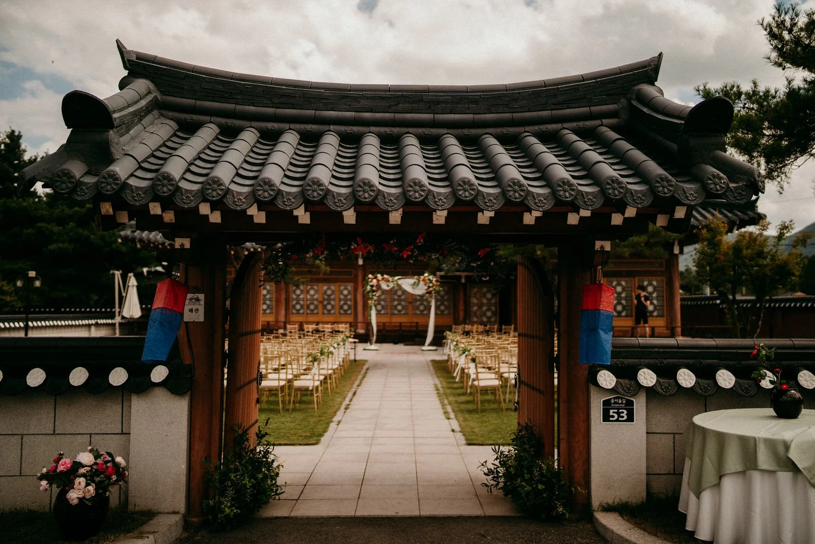 A traditional Korean hanok gate, set up for a wedding ceremony