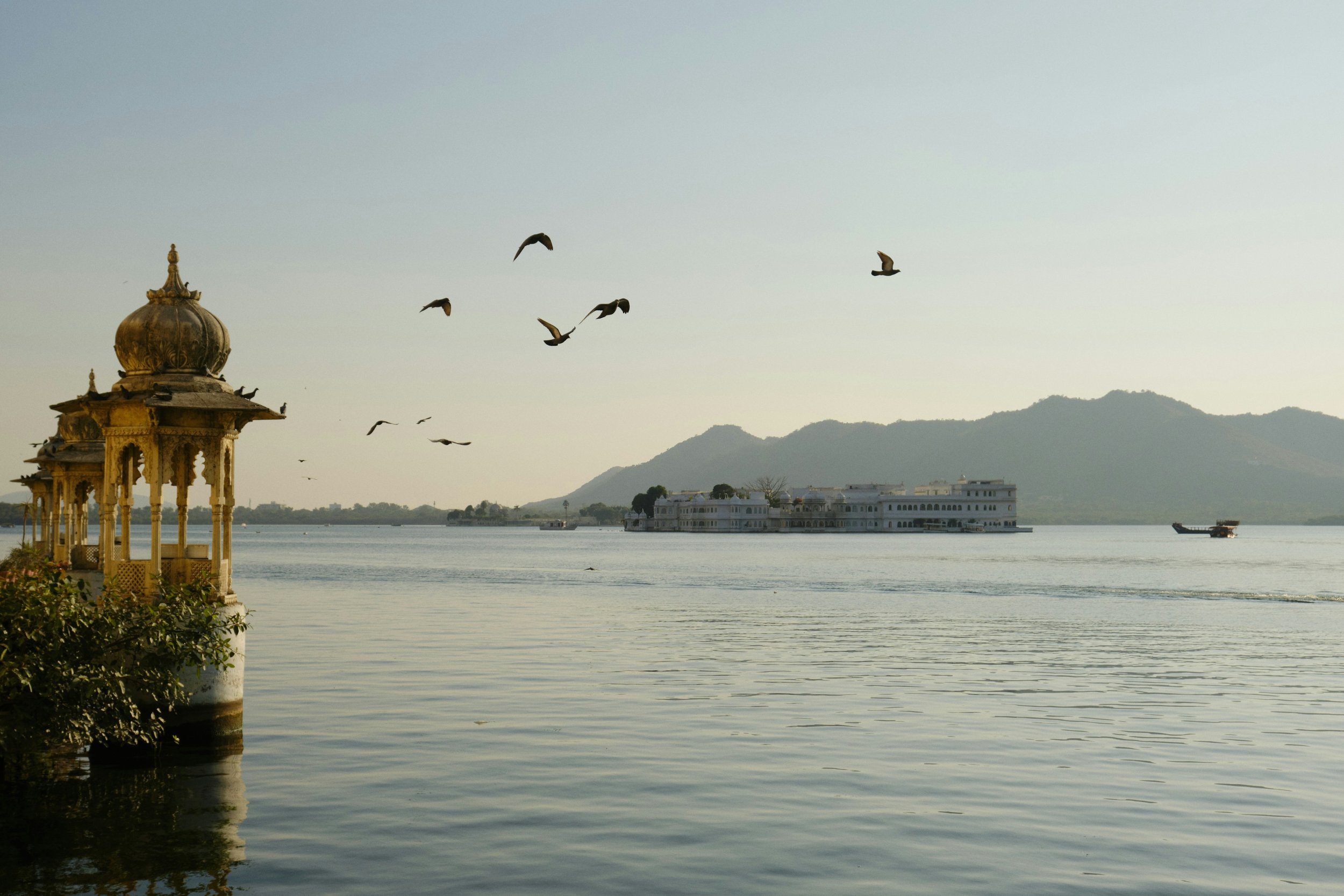 The Lake Palace floating on Lake Pichola in Udaipur, Rajasthan, at sunset
