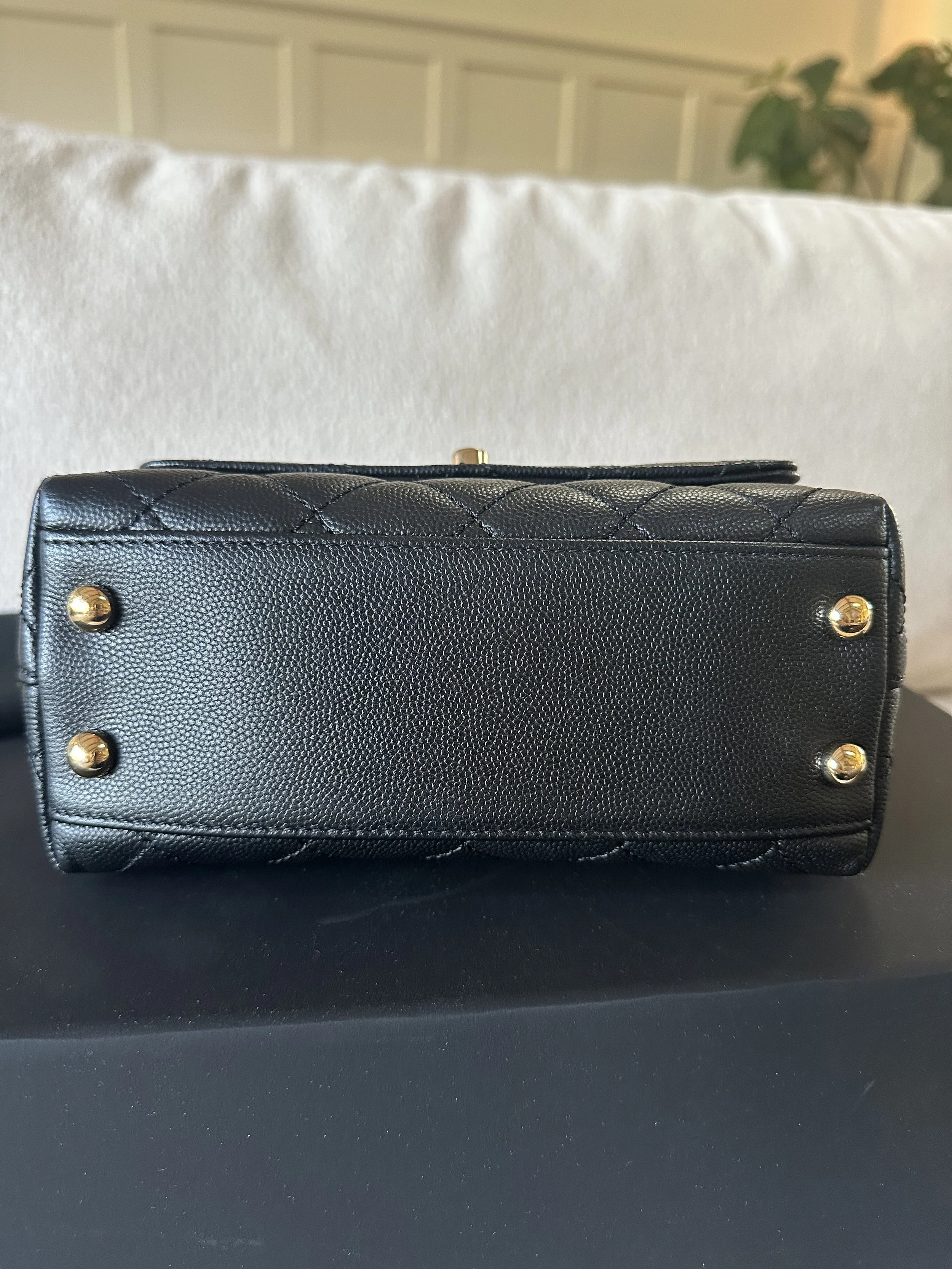 Chanel Mini Coco Top Handle base view gold protective studs black caviar leather