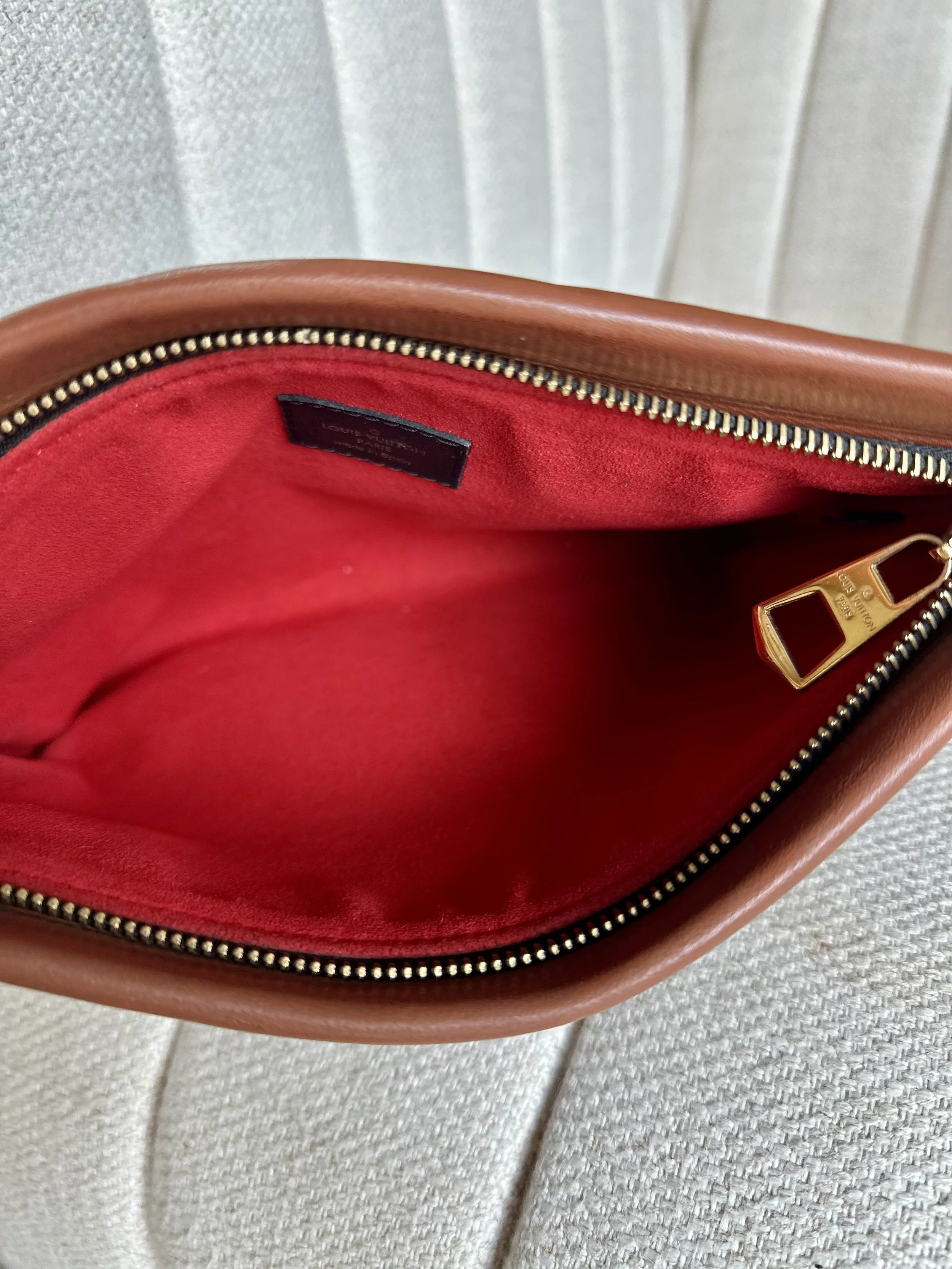 Louis Vuitton Tuileries Pochette open view, red suede interior