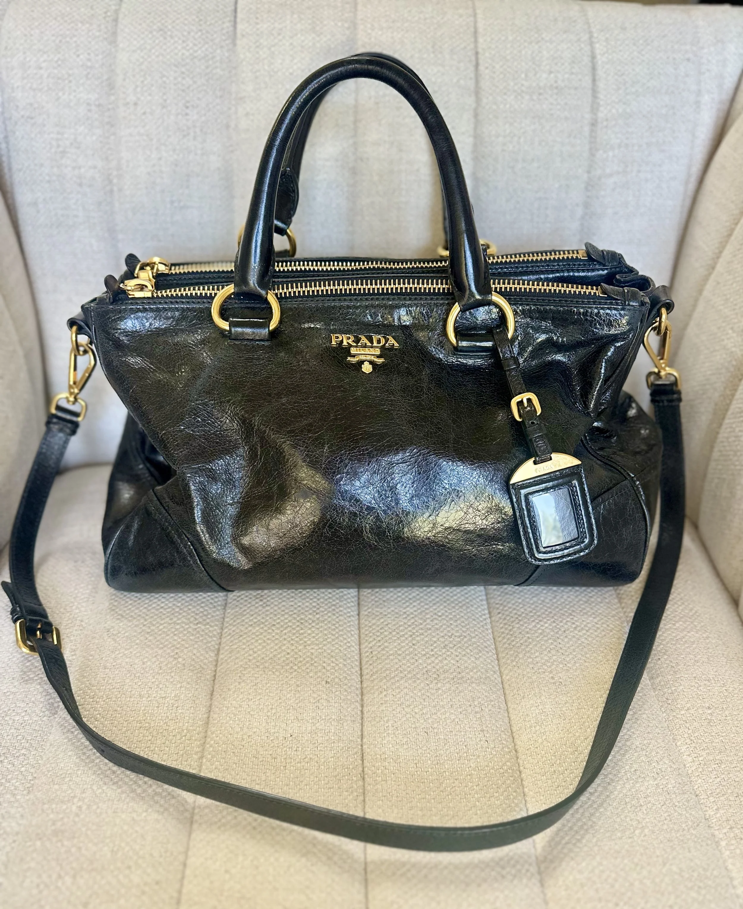 Prada Vitello Shine Double Zip Satchel black glazed calfskin gold hardware luggage tag shoulder strap