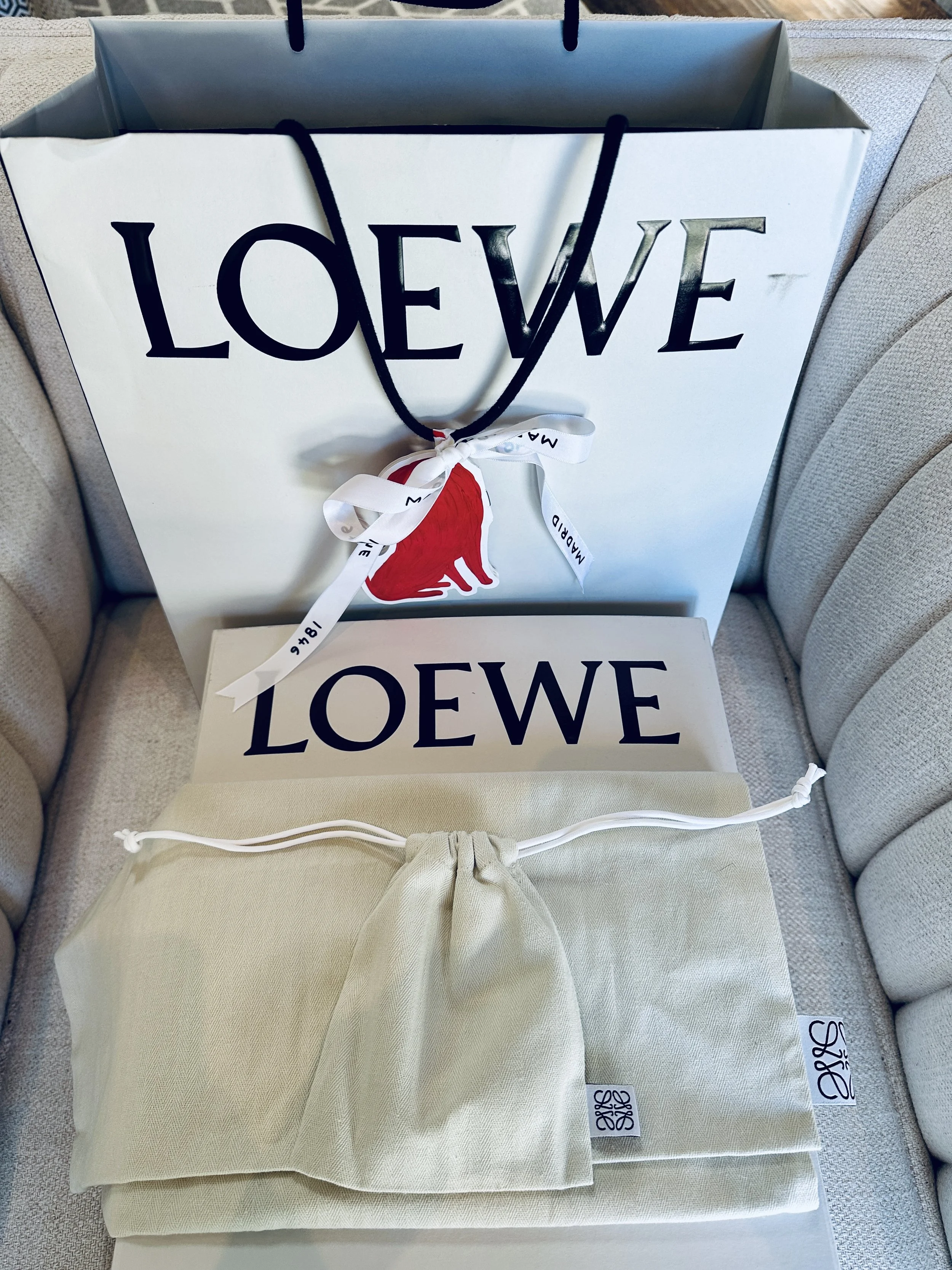 Loewe boutique packaging, box and dust bags close-up
