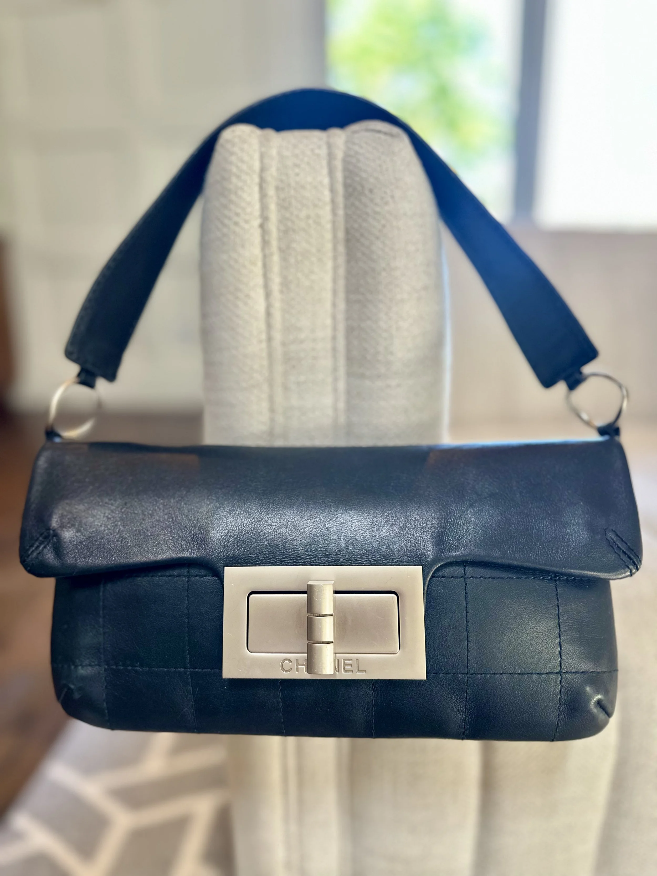 Authenticated vintage Chanel Mademoiselle shoulder bag black lambskin silver Mademoiselle turnlock Made in France Karl Lagerfeld era