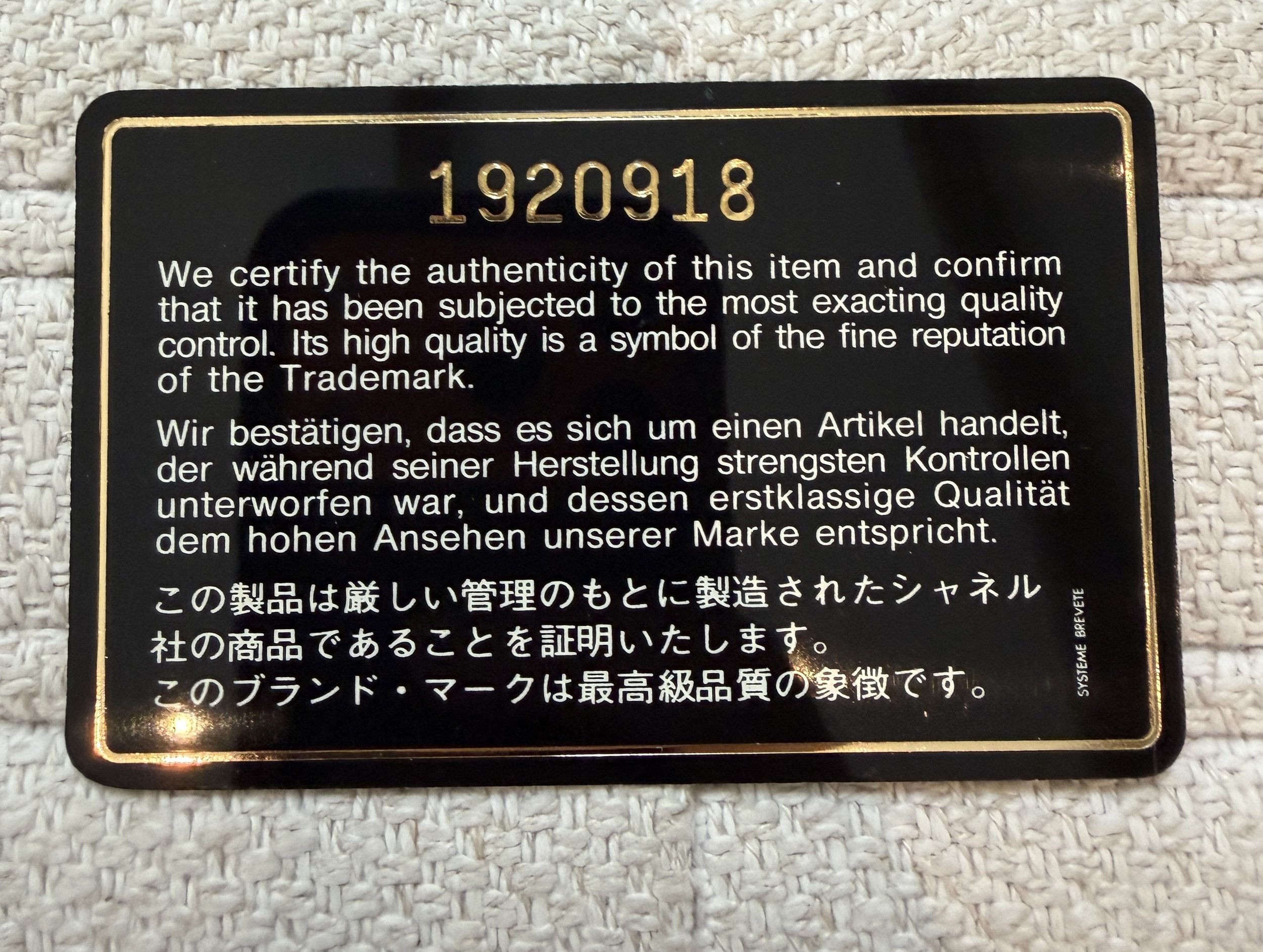Chanel authenticity card serial number 1920918, multilingual certification