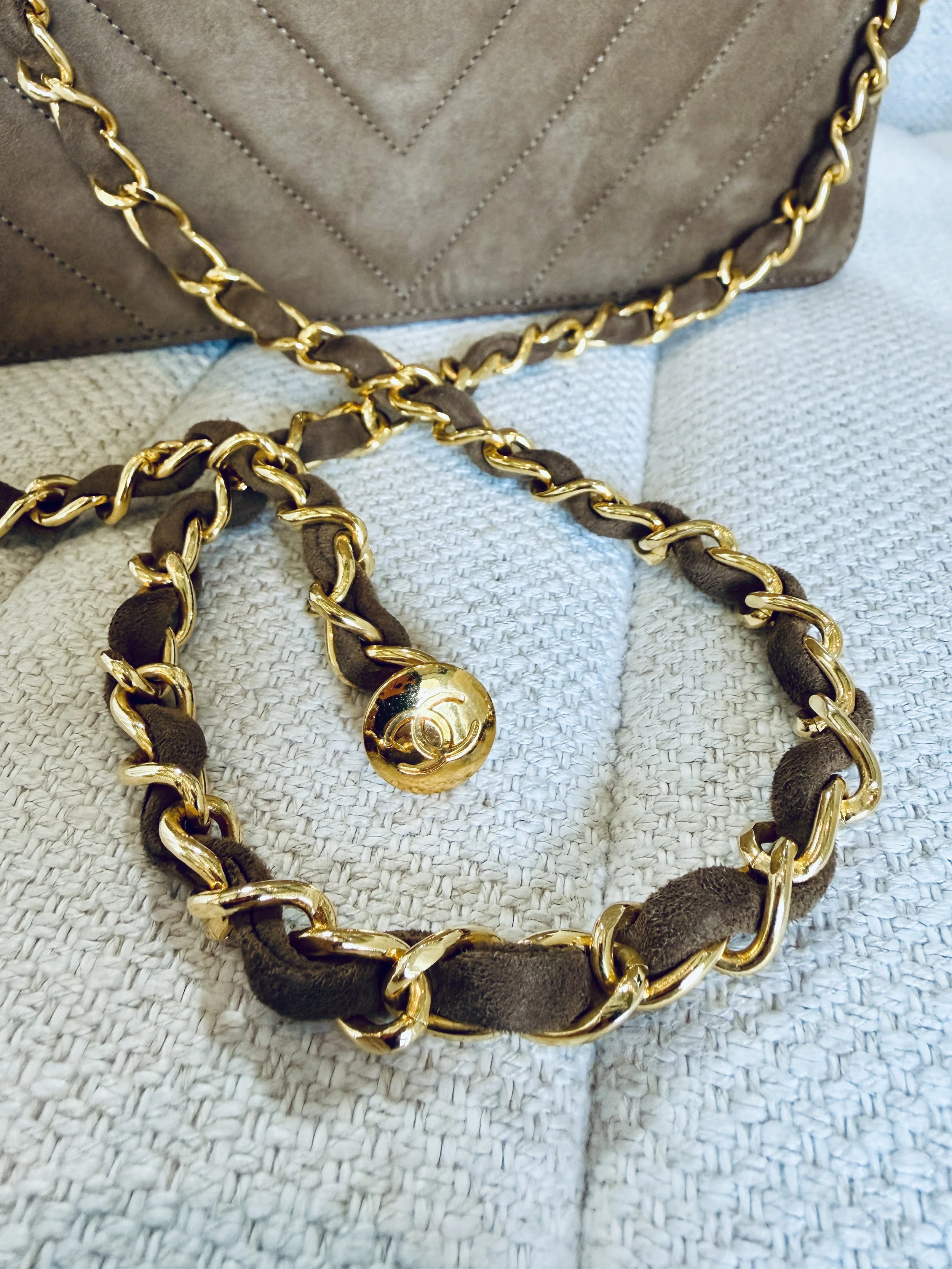 Chanel gold chain strap close-up, woven suede detail