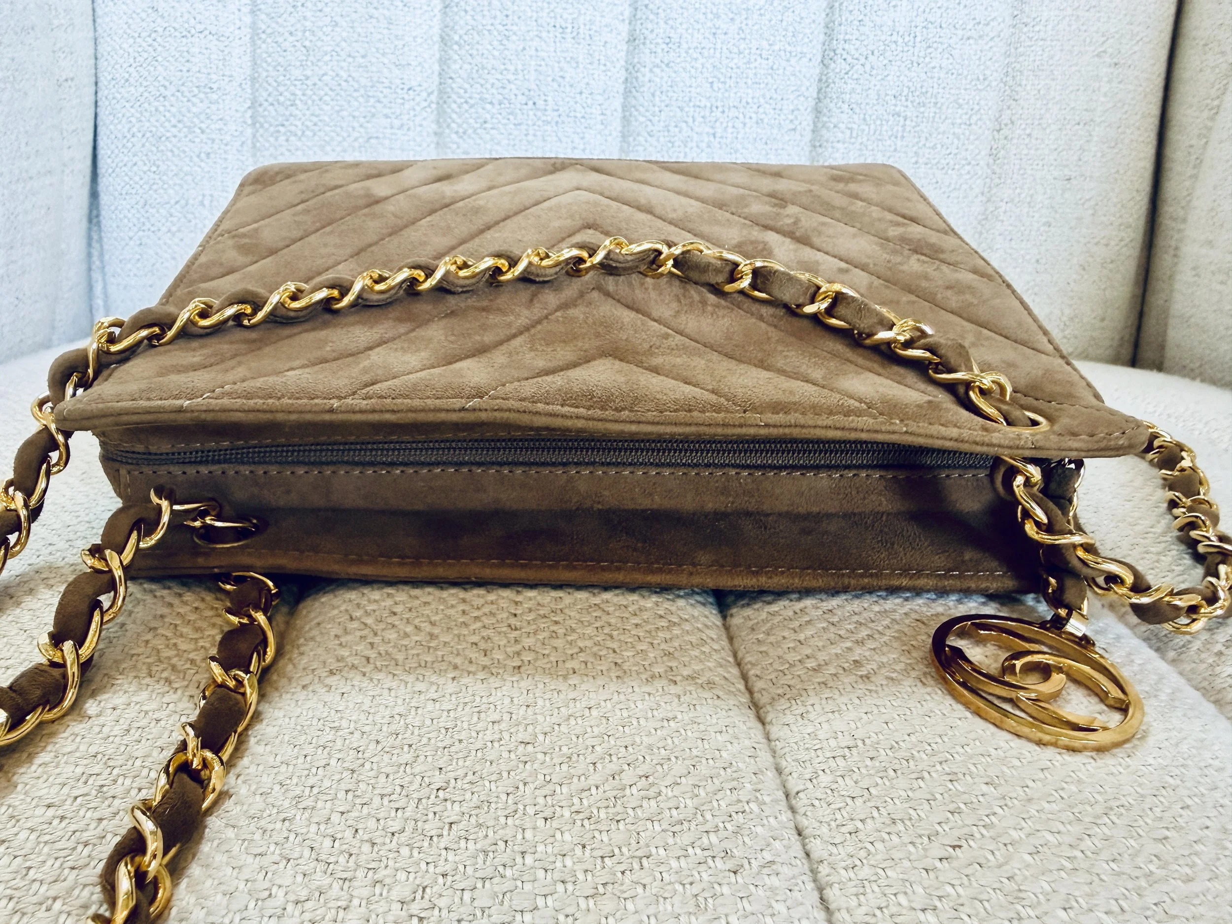 Chanel suede bag side view, zip closure detail