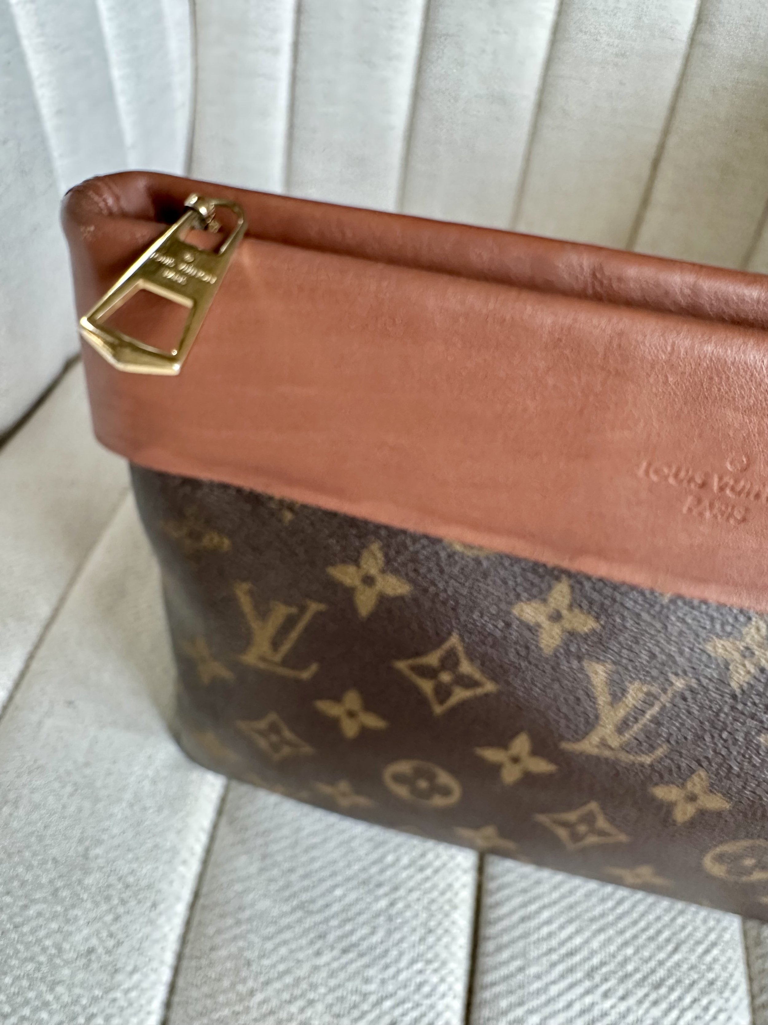 Louis Vuitton Tuileries Pochette gold-tone zipper pull detail