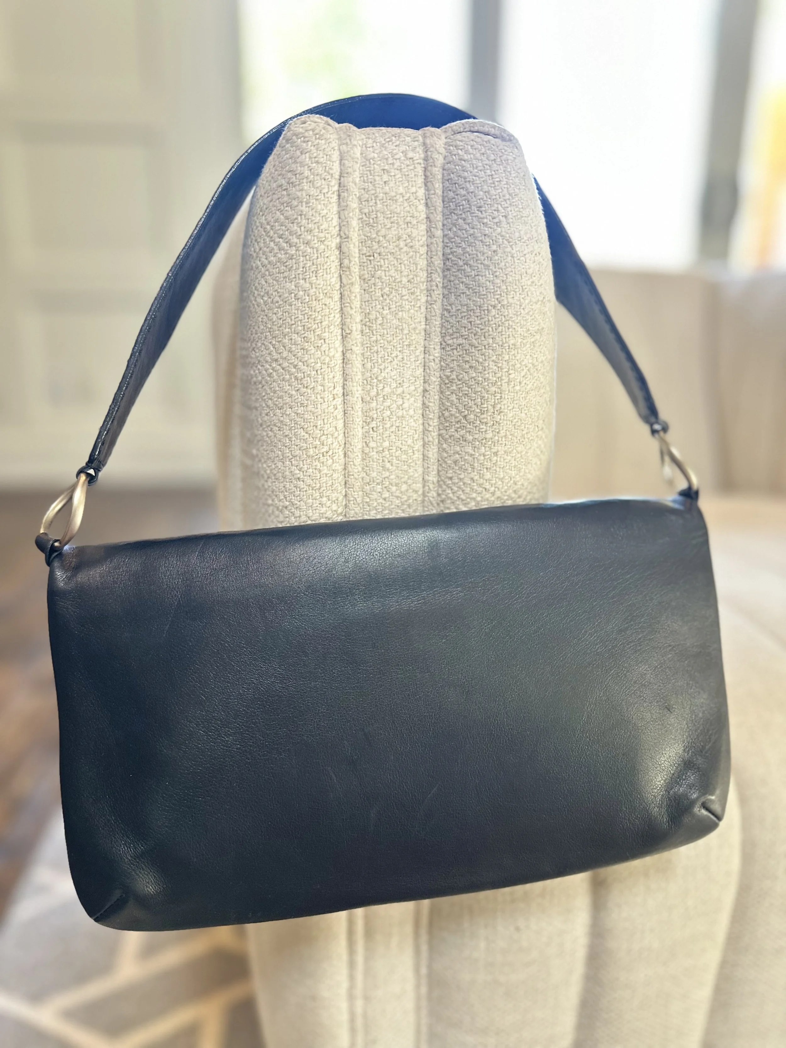 Chanel Mademoiselle shoulder bag back view black lambskin silver O ring hardware