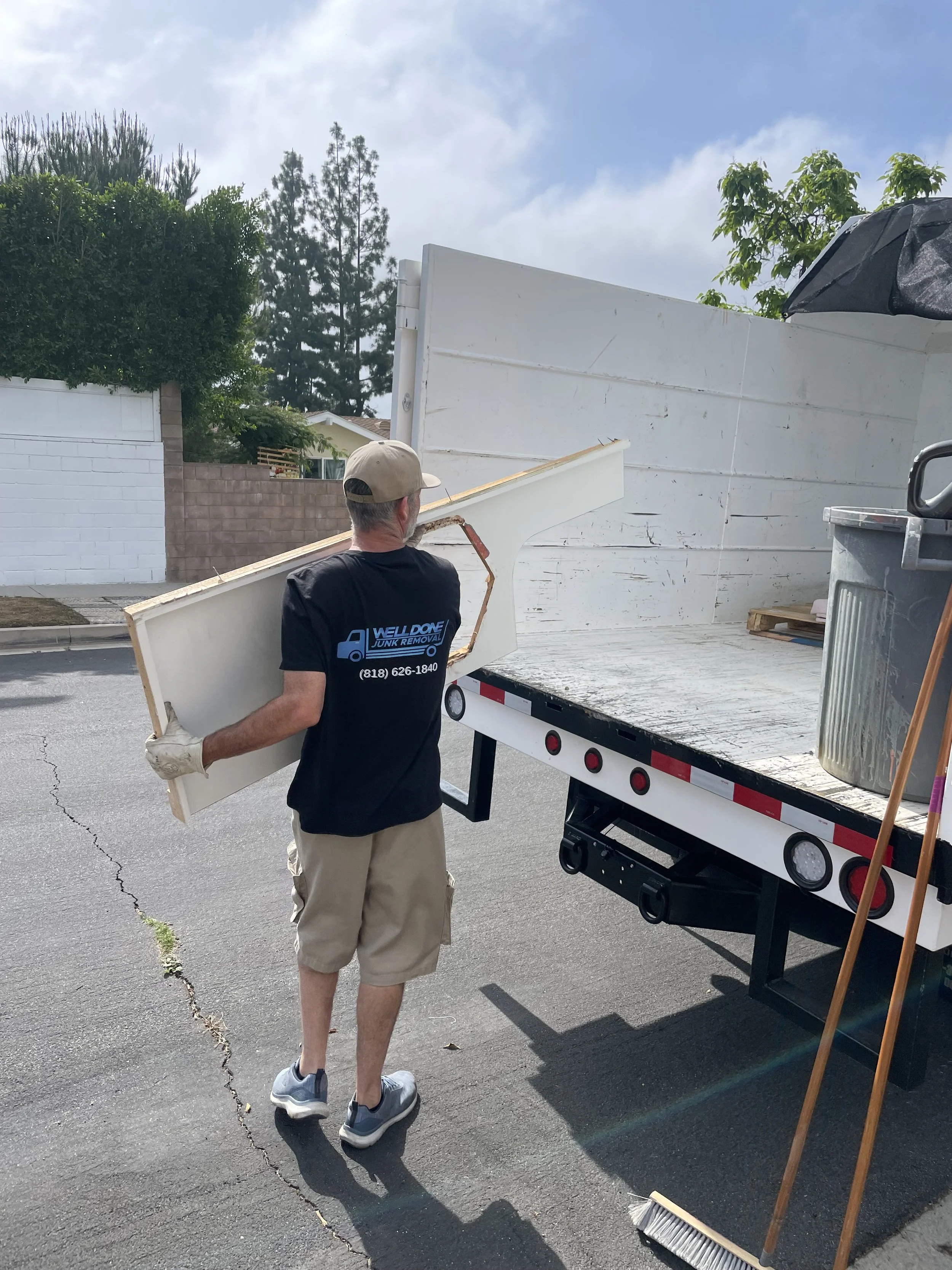 Junk removal in Northridge, CA. Loading the truck