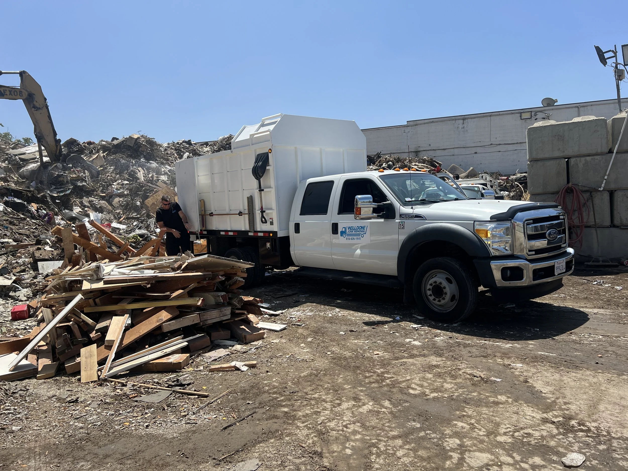 Well Done Junk Removal truck at the dump