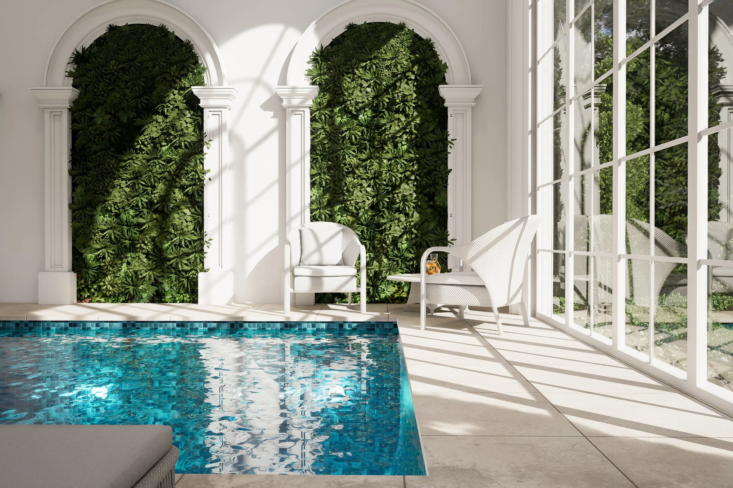 Indoor pool area with white chairs, lush green plants on wall, and large glass windows letting in sunlight.