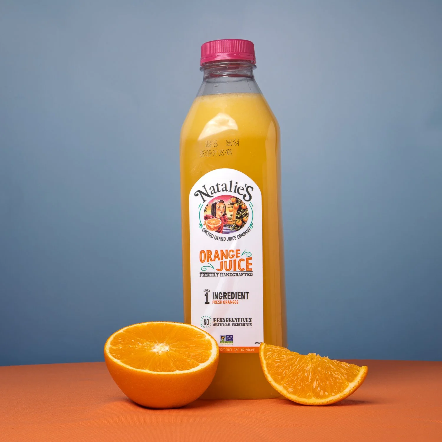 Natalie's orange juice bottle with a halved orange